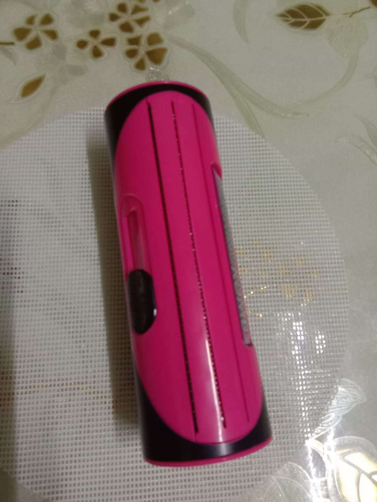 Pet grooming brush for dogs and cats in pink color, practical and simple cleaning accessory.