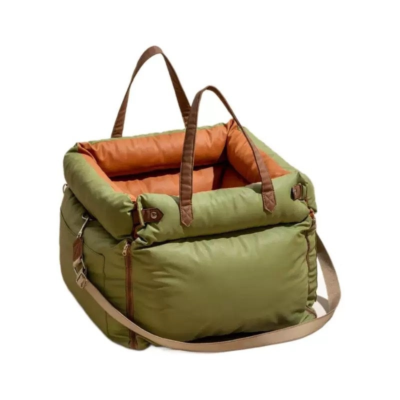 waterproof pet car seat cover in green with tan straps and orange lining