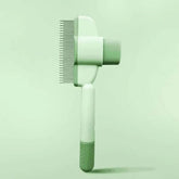 One-click pet grooming brush in green color, designed for gentle hair removal for dogs and cats.