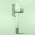 One-click pet grooming brush in green color, designed for gentle hair removal for dogs and cats.