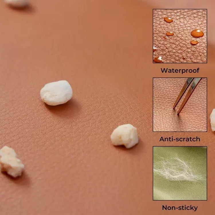 Close-up of waterproof pet car seat cover material showing anti-scratch features and water droplets on surface.