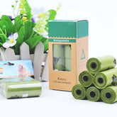 Hygienic dog poop bags in rolls with a biodegradable box, ideal for pet waste management.