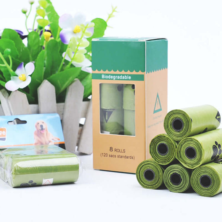 Hygienic dog poop bags in rolls with a biodegradable box, ideal for pet waste management.