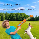Durable chew ball launcher for dogs being used outdoors to launch a tennis ball for a happy dog.