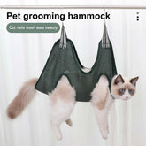 grooming hammock harness for pets, comfortable and safe cat grooming tool in use.