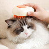 Person using electric steam brush for pets on a fluffy cat, enhancing grooming and coat care.
