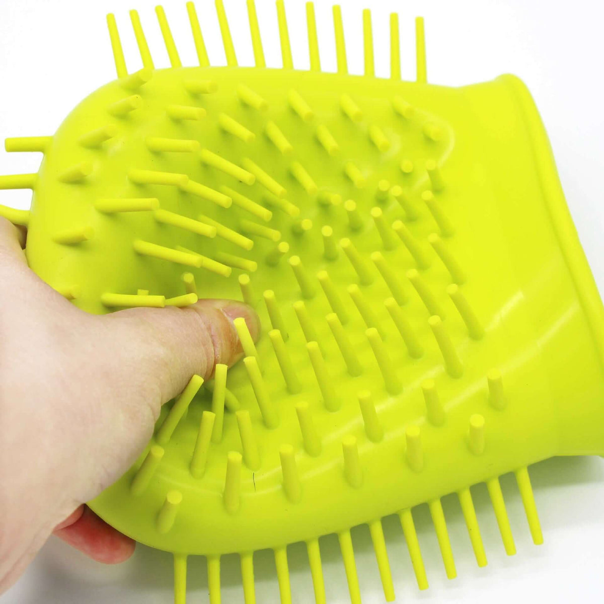 Portable dog paw cleaner with a textured surface and ergonomic design for easy pet grooming.