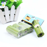 Hygienic dog poop bags in green eco-friendly packaging, displayed in a roll format for convenient pet waste disposal.