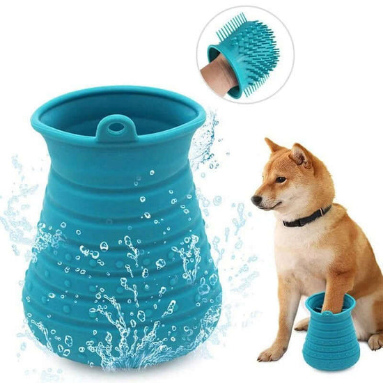 Portable dog paw cleaner with a blue cup washing dog paws, water splashing around.
