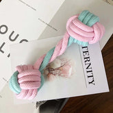 Interactive pet chew toy for dogs and cats made of cotton rope in blue and pink color.