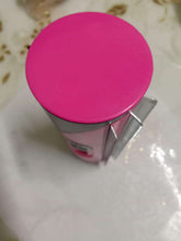 Close-up of a pet grooming brush for dogs and cats, featuring a pink cap and stainless steel design.