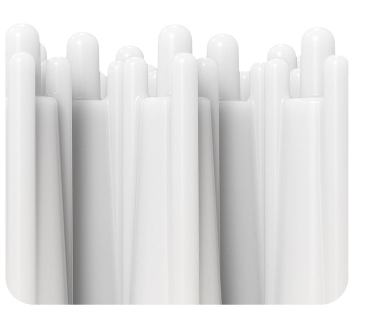 Close-up of a white pet bath massage brush with multiple bristles, designed for grooming dogs and cats.
