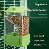 Automatic feeder for parrots showcasing a green plastic and acrylic food dispenser for pet birds.