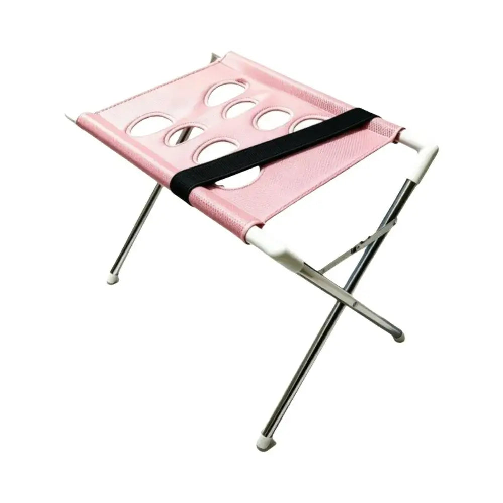 Foldable pet grooming table featuring a pink mesh surface with holes, designed for medium pets grooming convenience.