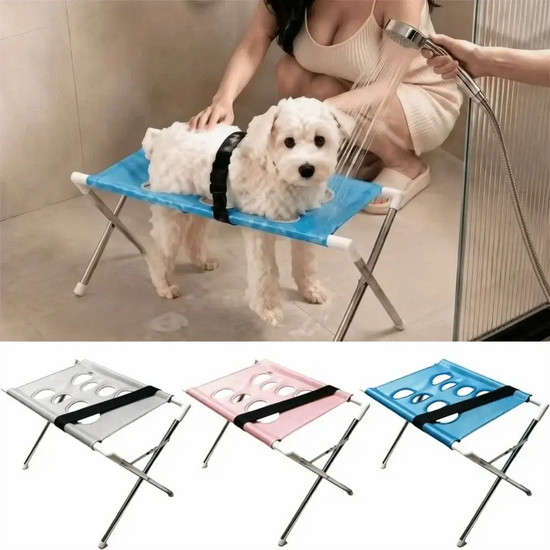 Foldable pet grooming table being used for dog washing with quick-dry mesh in a bathroom setting