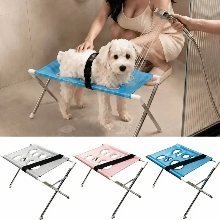Foldable pet grooming table being used for dog washing with quick-dry mesh in a bathroom setting