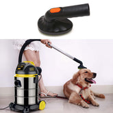 Pet grooming brush vacuum attachment in use with vacuum cleaner and a golden retriever dog.