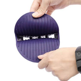 pet shampoo massage brush for dogs and cats being held, showcasing its ergonomic design and flexible bristles.