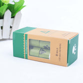 Hygienic dog poop bags packaged in biodegradable box with 8 rolls for pet waste management.