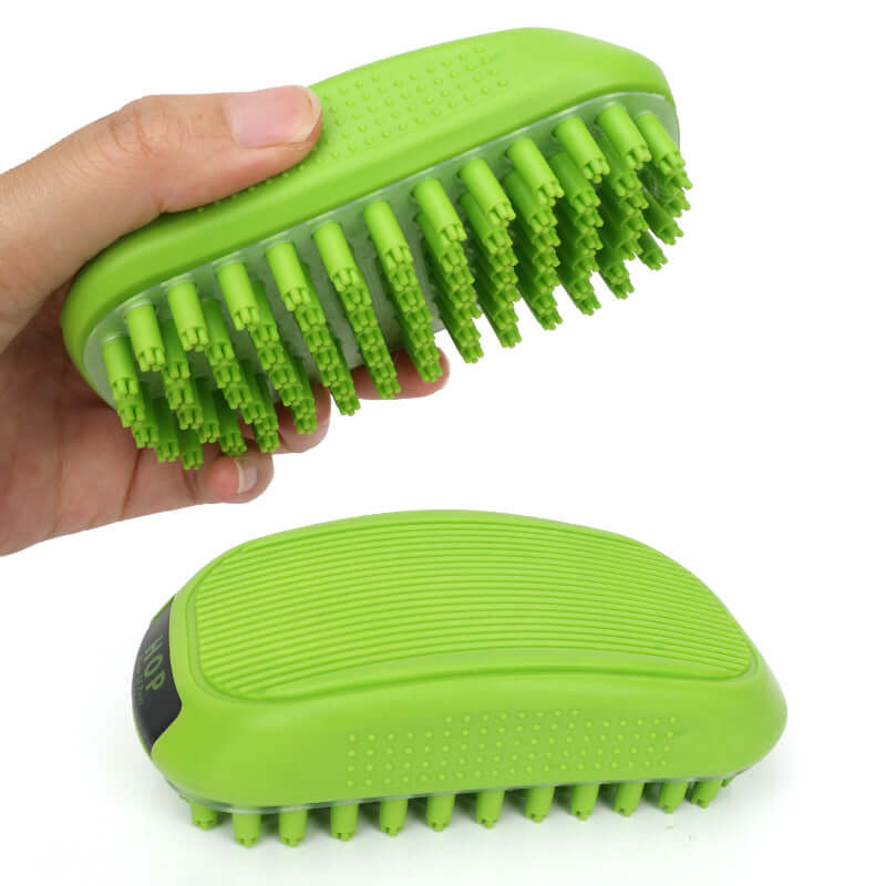 Hand holding a green pet bath brush, part of the dog grooming and cleaning tools collection.