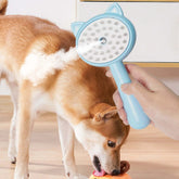 steam cleaning grooming brush for cats in use, efficiently removing pet hair while providing a massage to a dog.