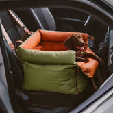 Waterproof pet car seat cover with a dog sitting comfortably in a car seat.